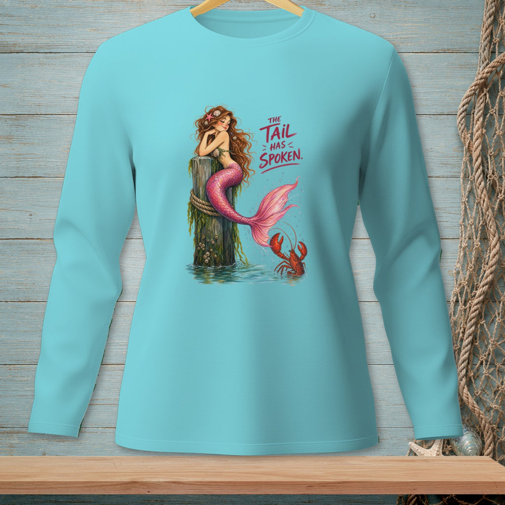 Mermaid sitting on post with lobster and text "The Tail Has Spoken".
