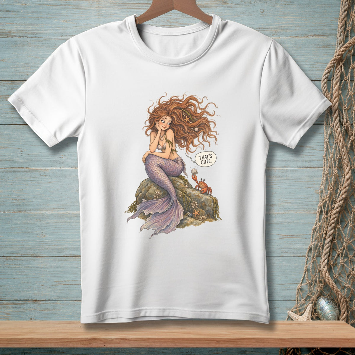 Mermaid with purple tail sits on rock, crab says "That's cute".