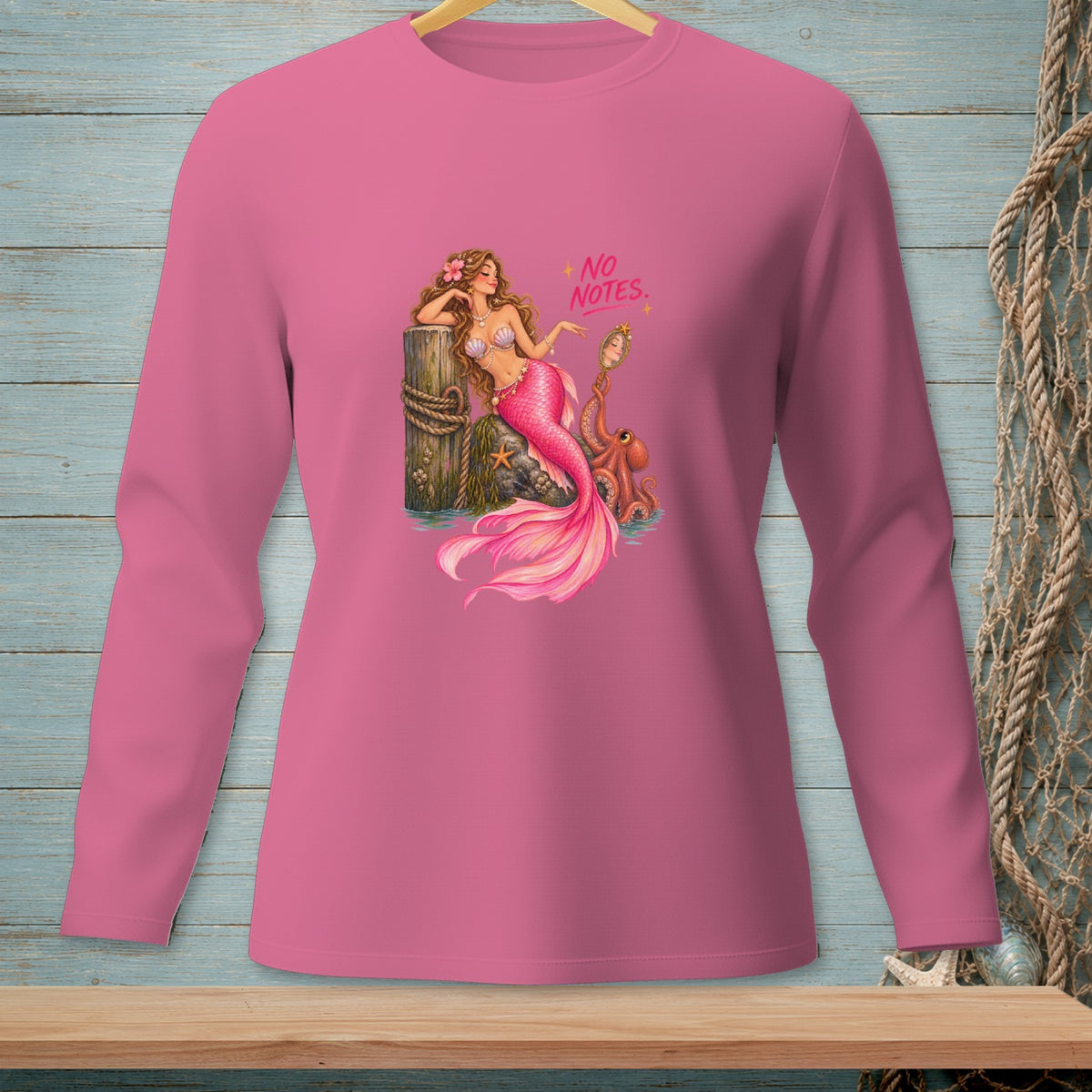 Pink long sleeve shirt with a mermaid, octopus, and text "NO NOTES".