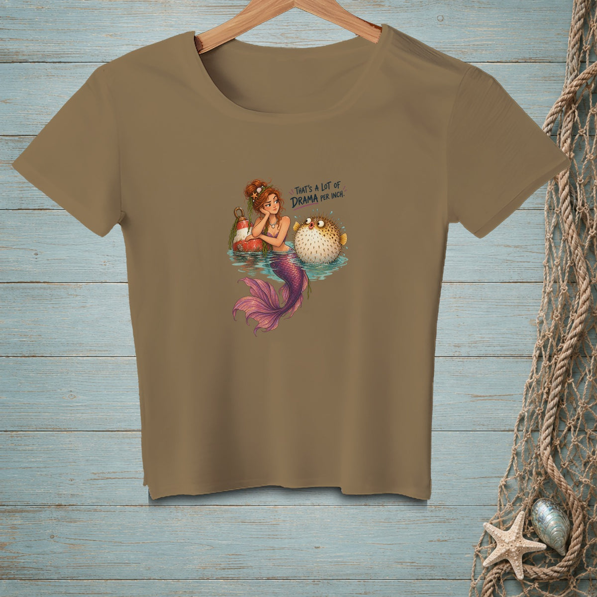Mermaid and pufferfish illustration with text "That's a lot of drama per inch."