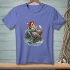 Mermaid with wine and cheese on rocks with a seagull, printed on a purple t-shirt.