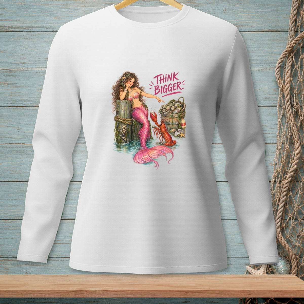 Long-sleeve white shirt with a mermaid, lobster, and bucket of oysters, featuring text "THINK BIGGER".