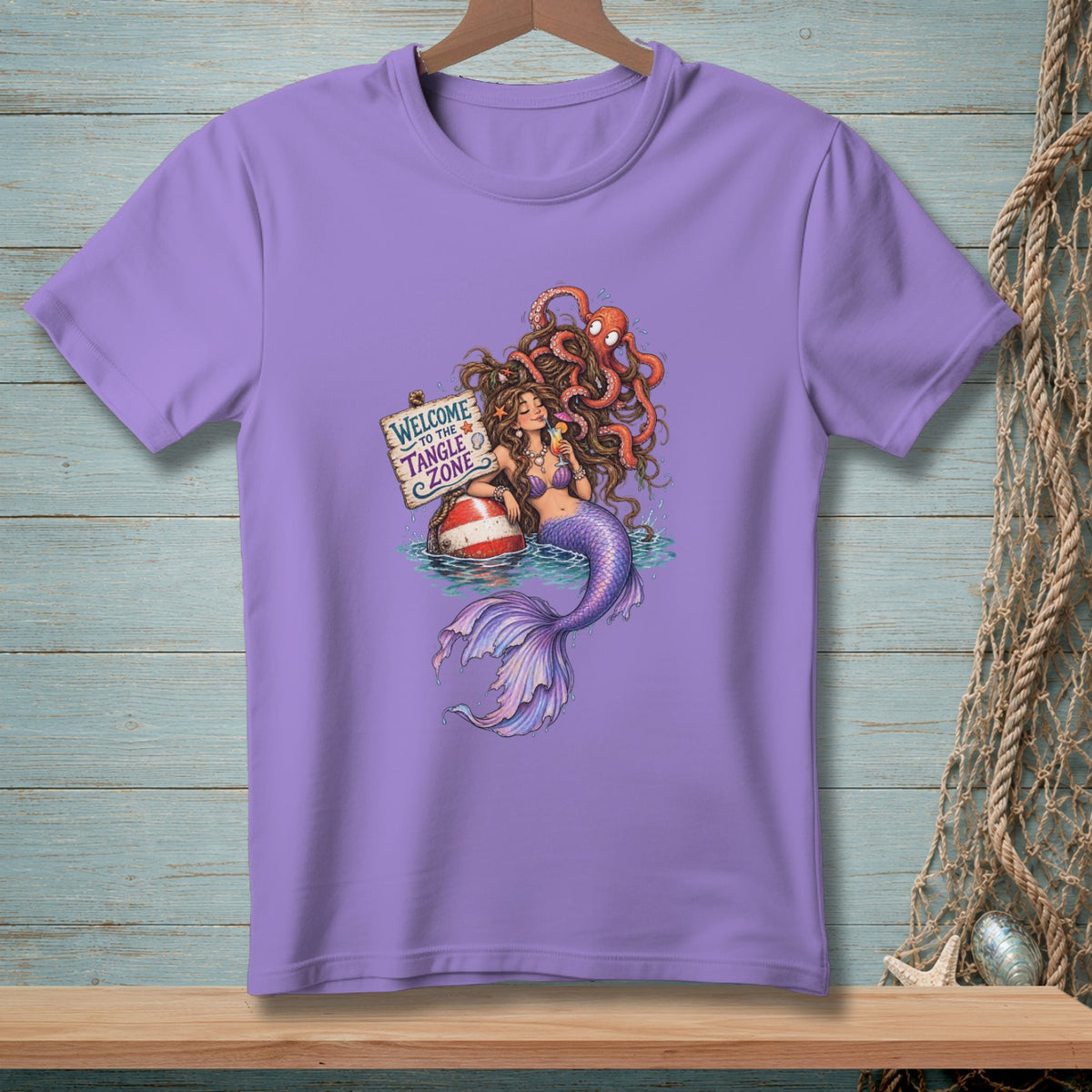 Purple t-shirt with mermaid, octopus, and welcome to the tangle zone sign.