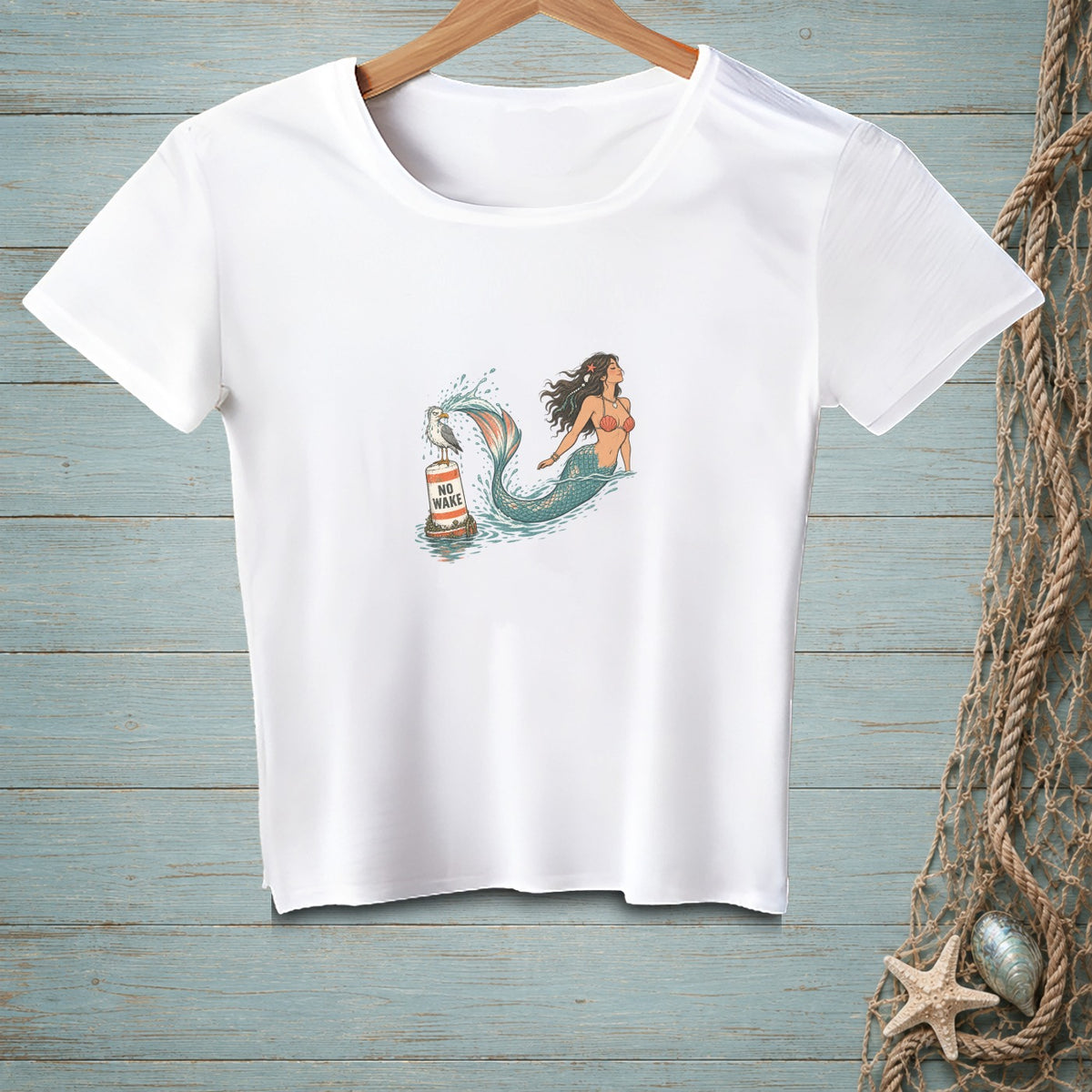 White t-shirt with mermaid and seagull on a buoy with "NO WAKE" text.