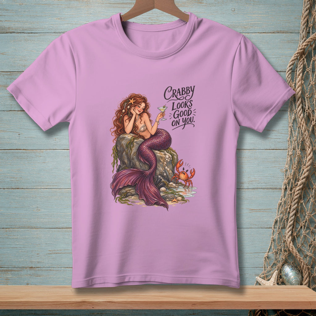 Pink t-shirt with a mermaid, crab, and text "Crabby Looks Good On You."