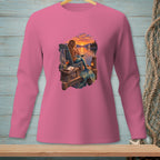 Pink long-sleeve shirt with a graphic of a mermaid sitting by the water at sunset.