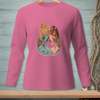 Two mermaids sitting on a wooden dock, one holding a mirror to her face.