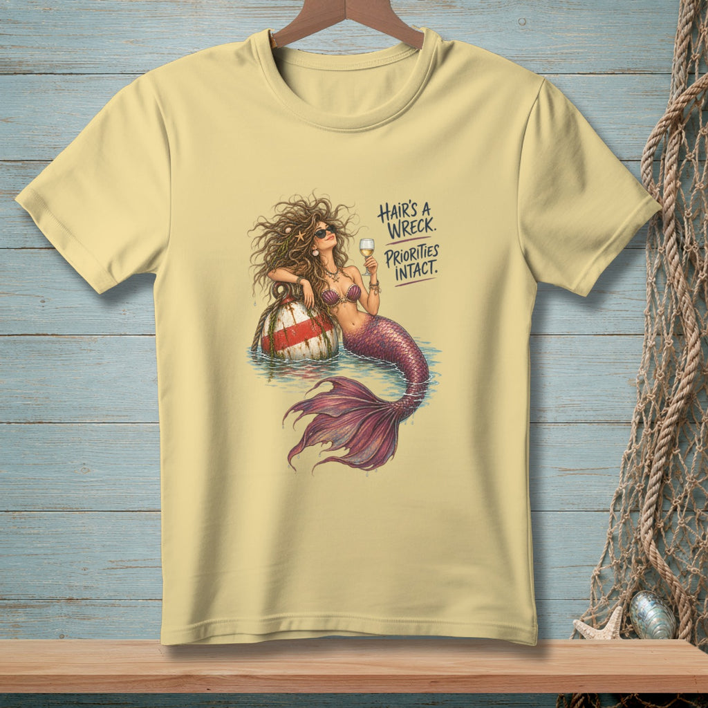 Yellow t-shirt with a mermaid design and text "HAIR'S A WRECK. PRIORITIES INTACT."