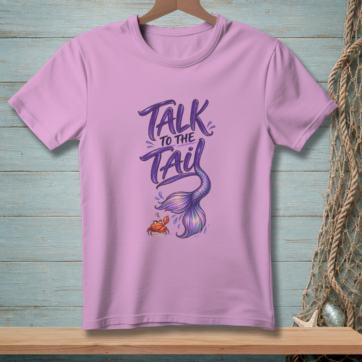Purple t-shirt with "Talk to the Tail" text and mermaid tail graphic.