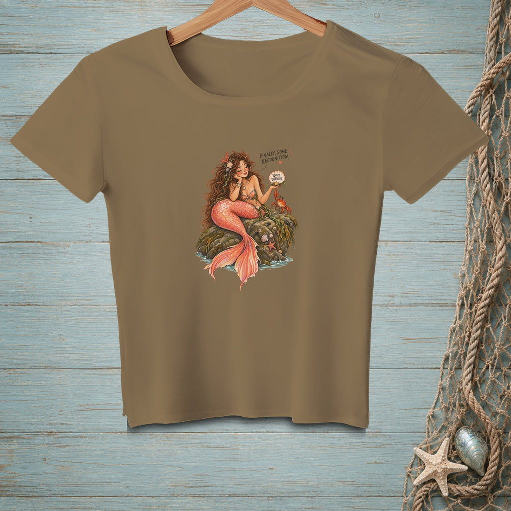 T-shirt graphic of a mermaid on a rock with a crab and text bubbles.