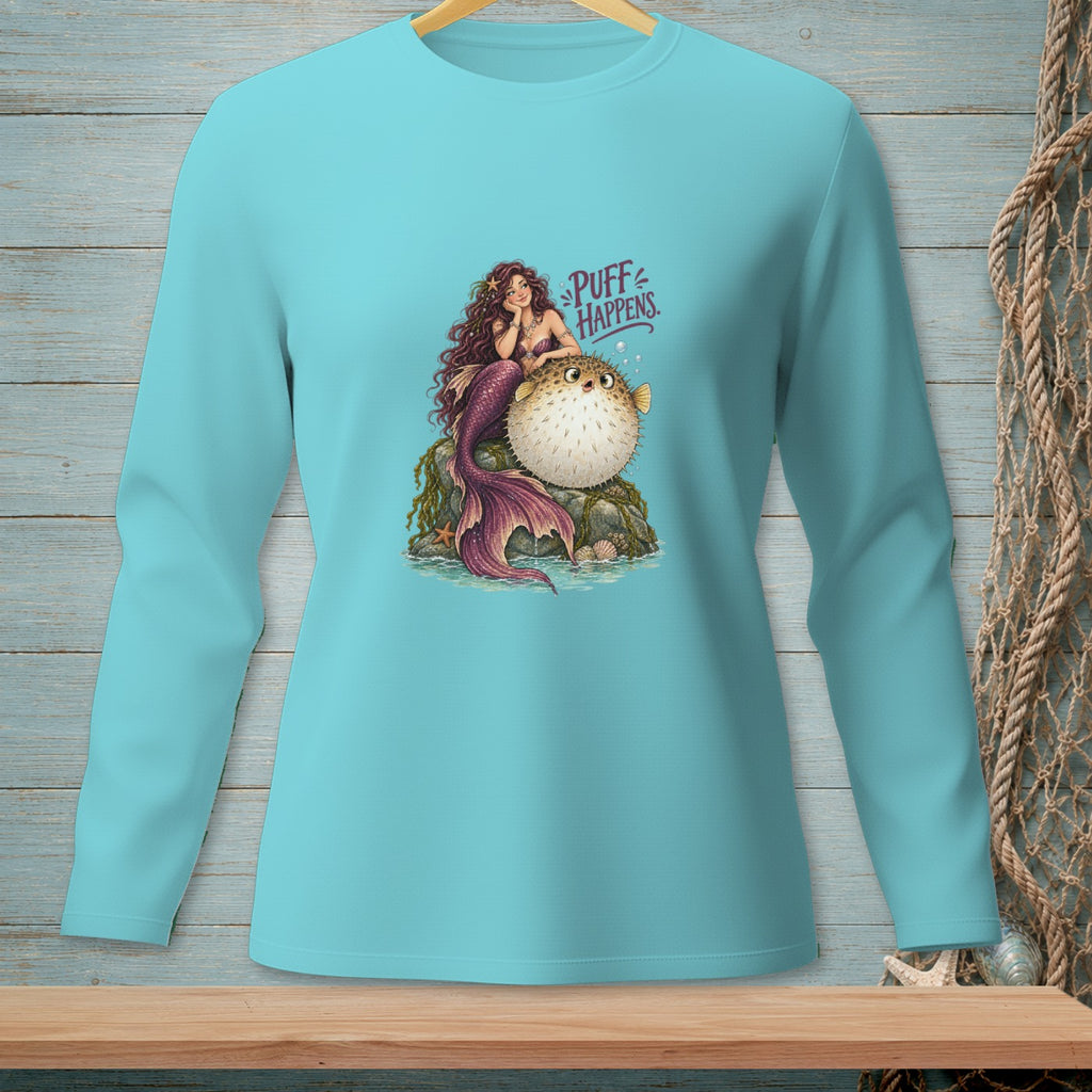 Light blue long-sleeve shirt with a graphic of a mermaid and pufferfish with text "Puff Happens."