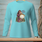 Light blue long-sleeve shirt with a graphic of a mermaid and pufferfish with text "Puff Happens."