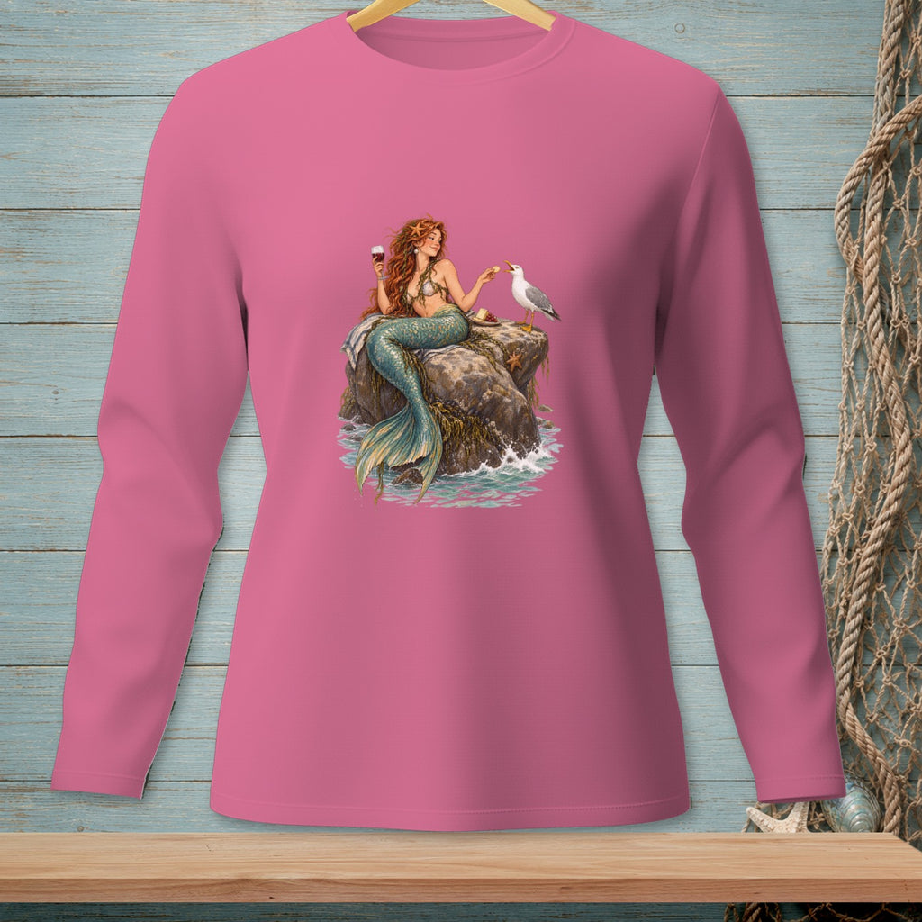 Pink long-sleeve shirt with mermaid, seagull, and wine graphic on a rock.