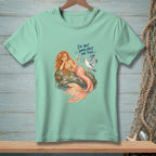 Mint t-shirt with a mermaid and seagull design, reading "I'M NOT AVAILABLE FOR THIS."
