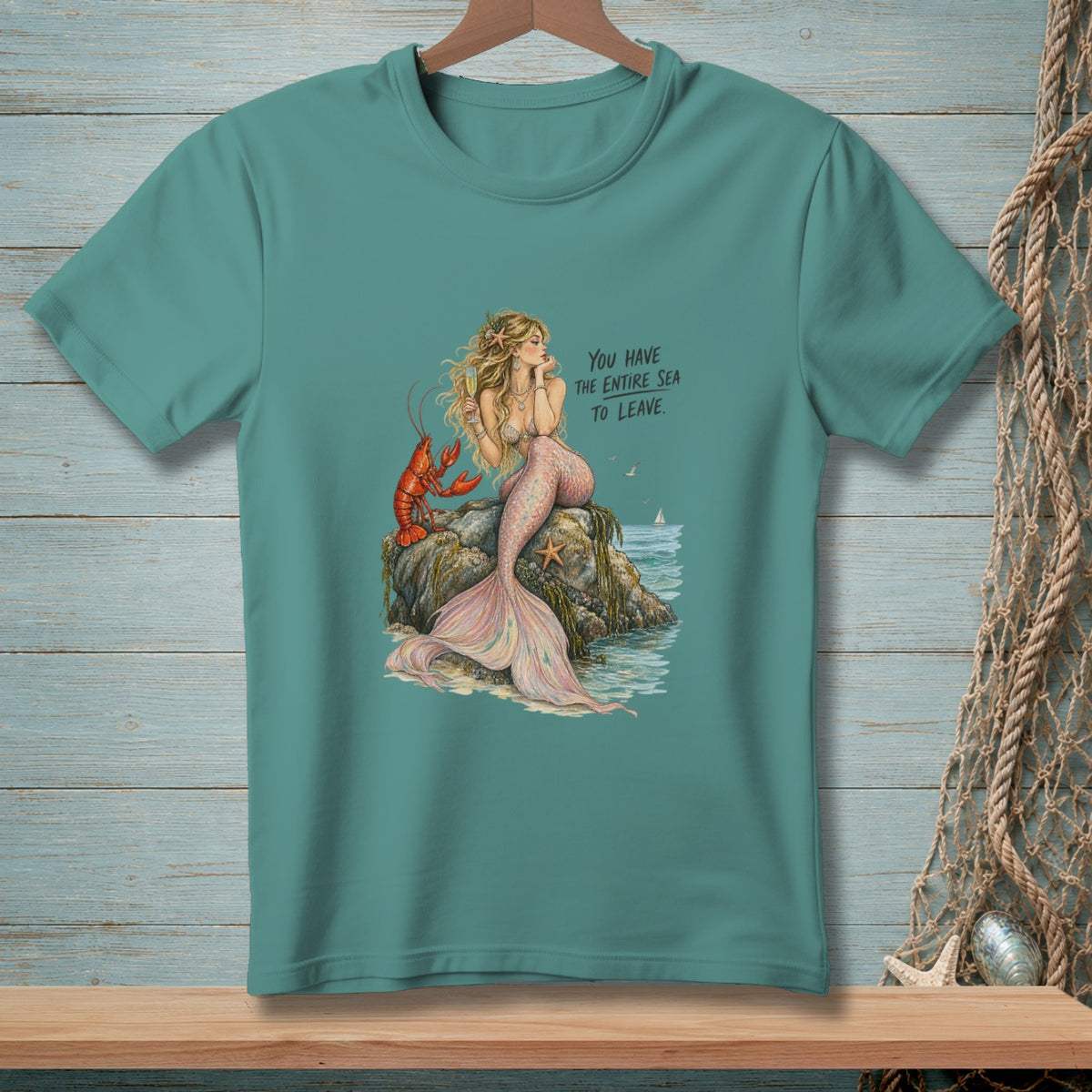 Mermaid with lobster on rock, text "YOU HAVE THE ENTIRE SEA TO LEAVE."