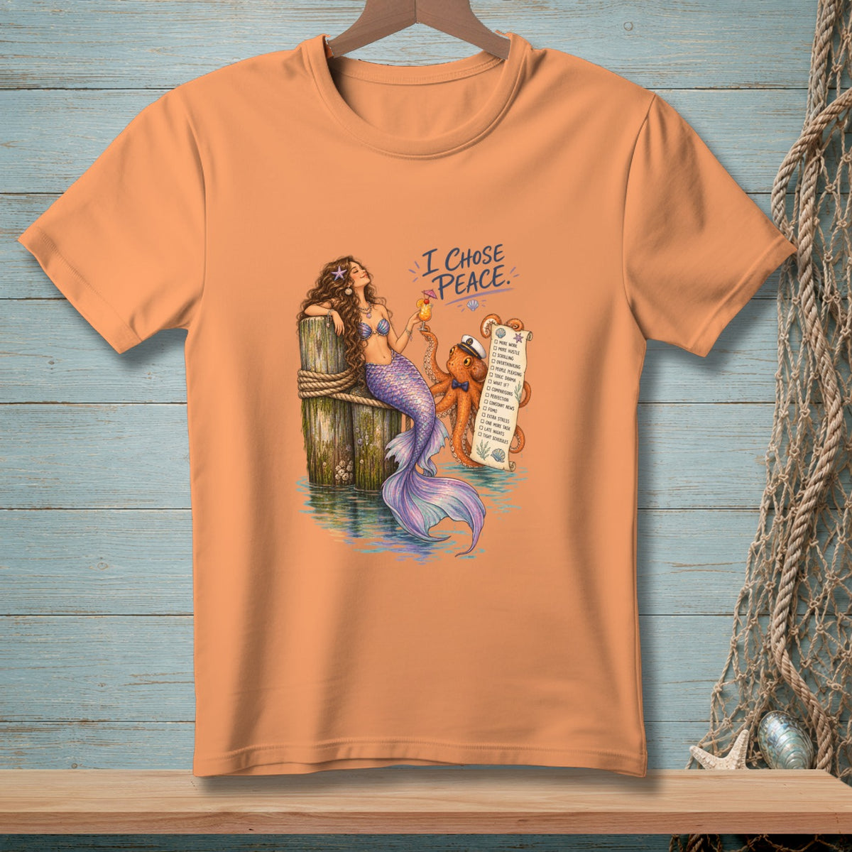 Mermaid and octopus with a list titled "I Chose Peace" on an orange t-shirt.