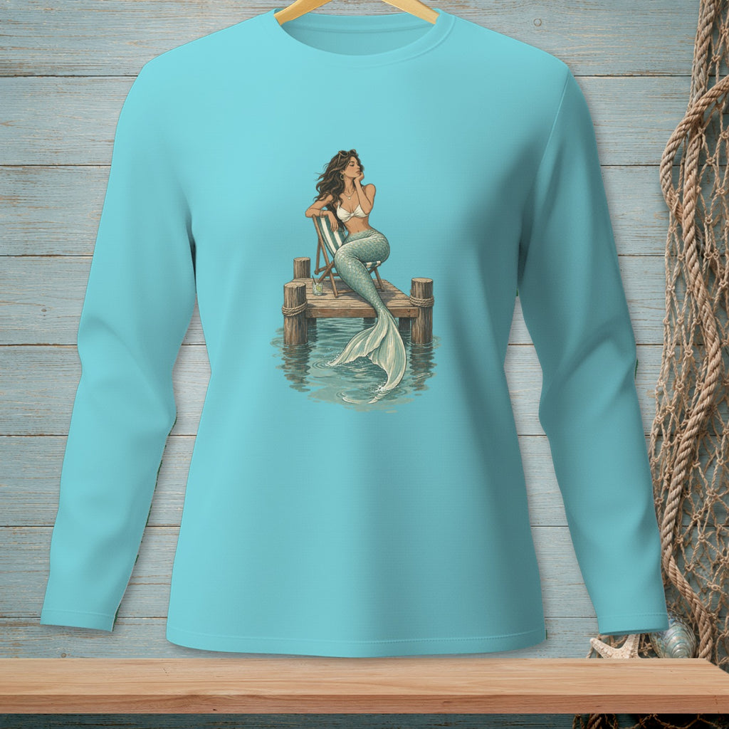 Illustration of a mermaid sitting on a wooden dock with a drink.