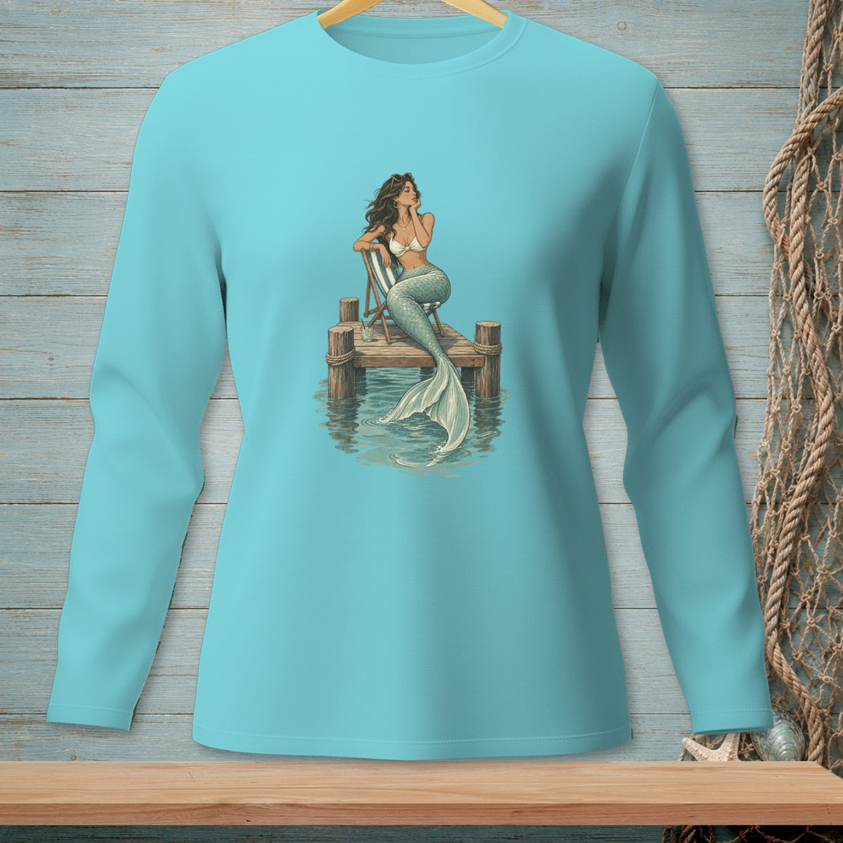 Illustration of a mermaid sitting on a wooden dock with a drink.
