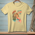Mermaid with lobster on post, text reads "KEEP YOUR CLAWS ON".