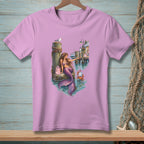 Mermaid with purple tail sits by docks with a crab and gift bag.