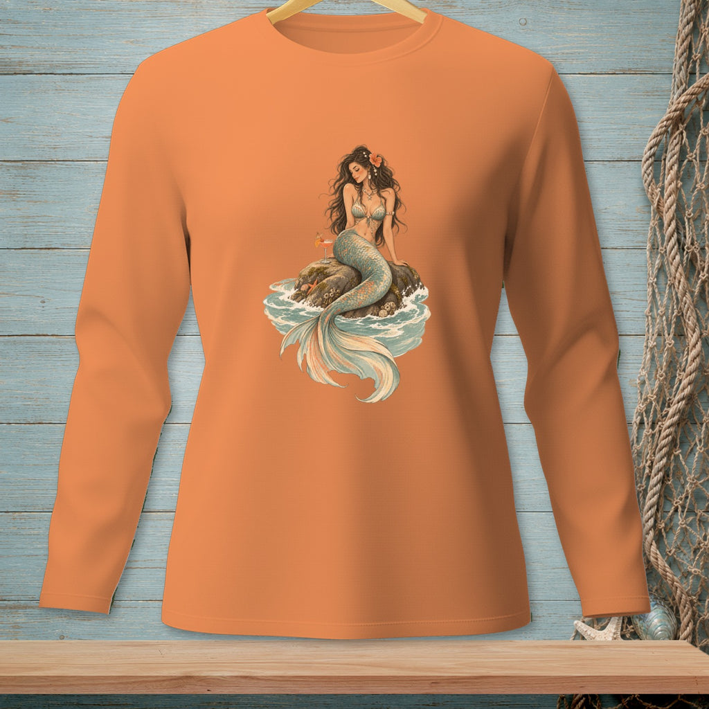 Orange long-sleeve shirt with a mermaid sitting on a rock with a drink.