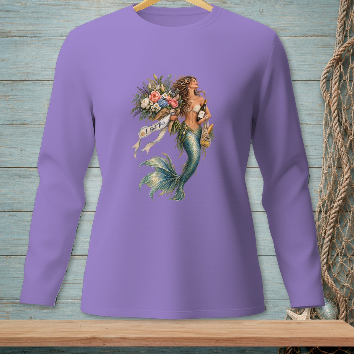 Mermaid graphic with flowers, wine, and bread on a purple long-sleeved shirt.