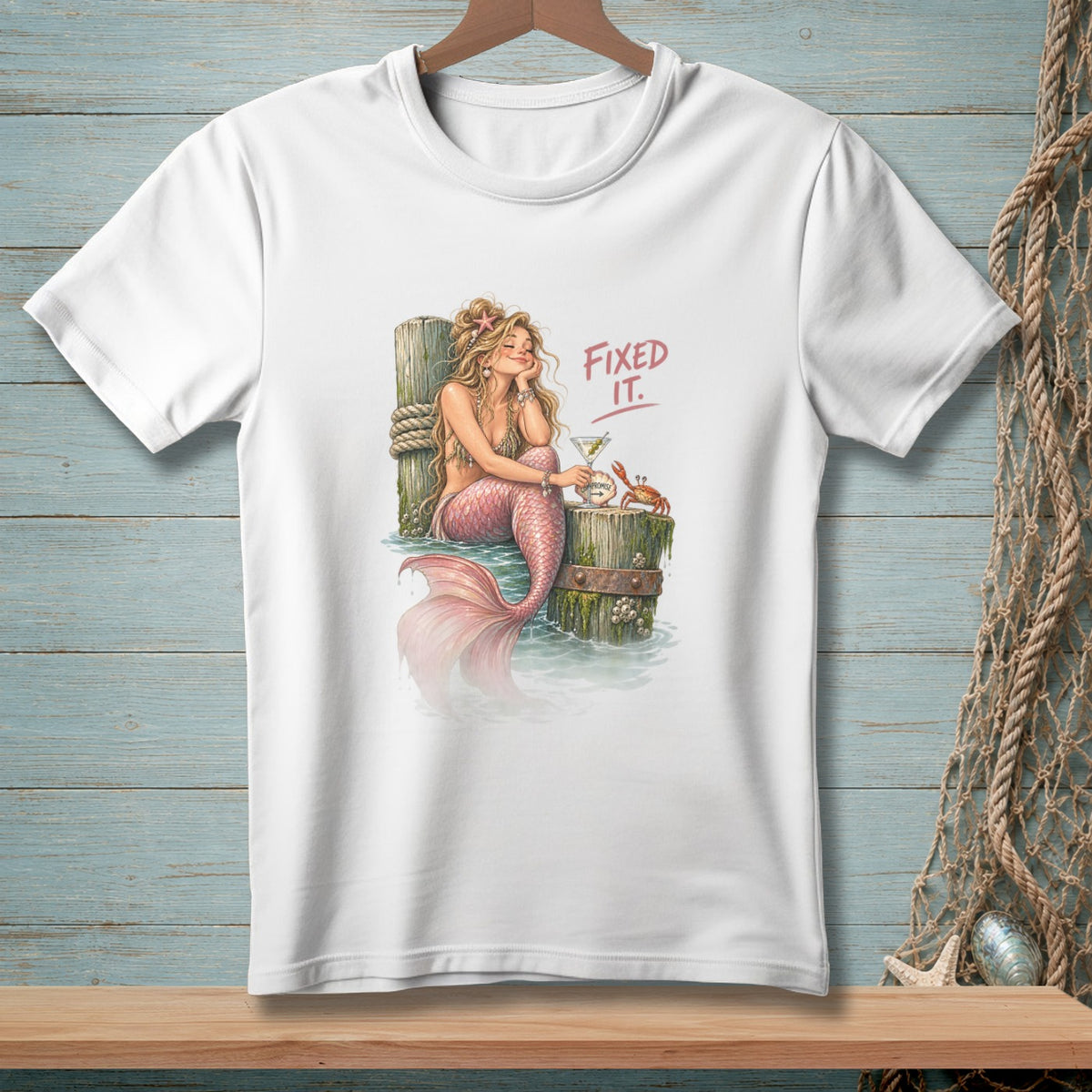 Mermaid with pink tail and martini glass, with "FIXED IT." text.