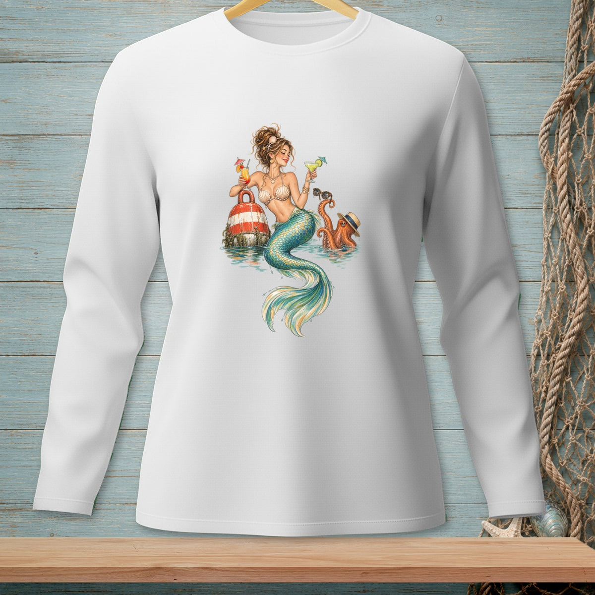 White long-sleeve shirt with a mermaid, octopus, and buoy graphic.