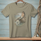 Taupe t-shirt with a watercolor illustration of a mermaid on a rock.