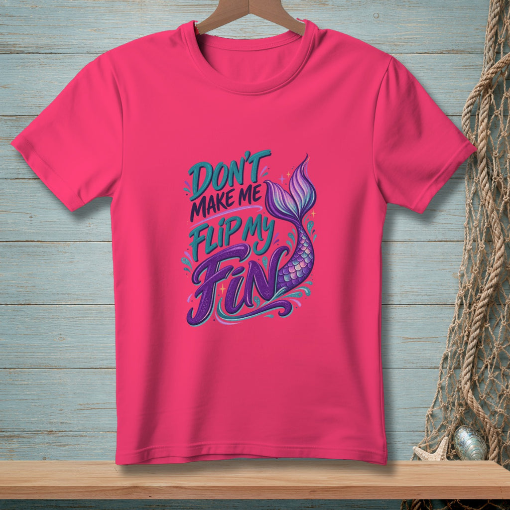 Pink t-shirt with text "DON'T MAKE ME FLIP MY FIN" and a mermaid tail.