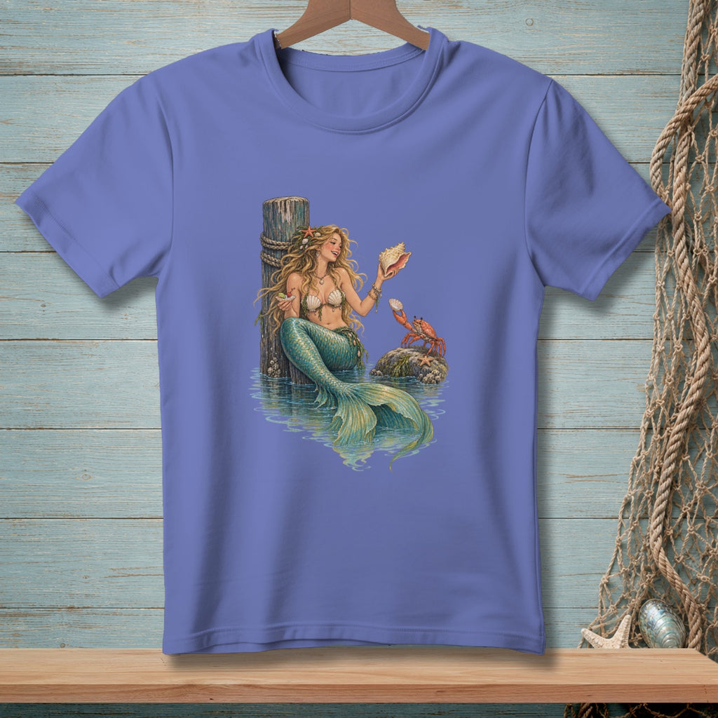 Mermaid holding a seashell by a wooden post with a crab on a rock.