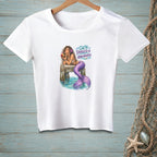 White t-shirt with mermaid and text "SALTY, TANGLED & UNBOTHERED" graphic.
