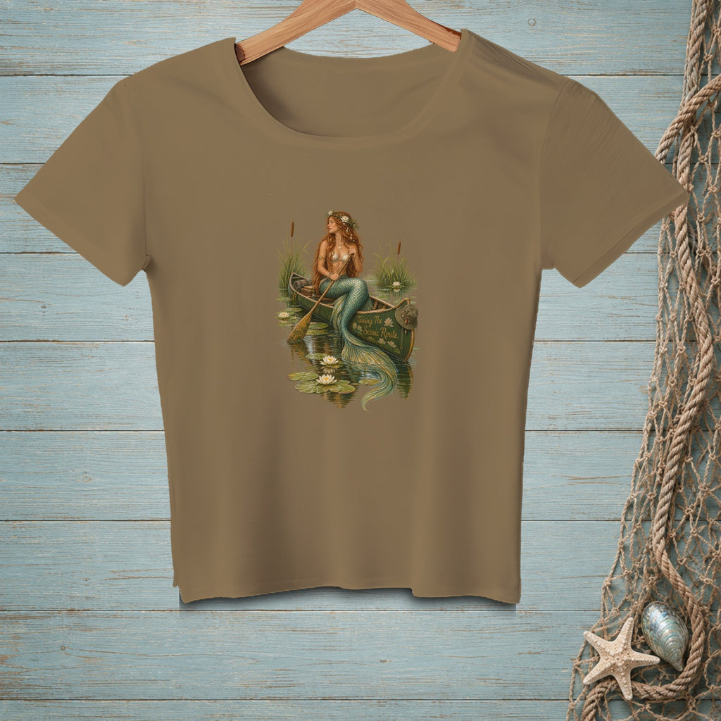 Mermaid in a canoe with lily pads, text reads "Taking The Scenic Route".