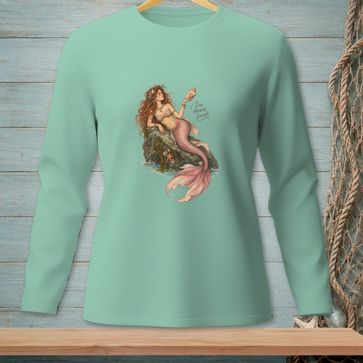 Mint long sleeve shirt with mermaid illustration and text "I've Heard Enough".