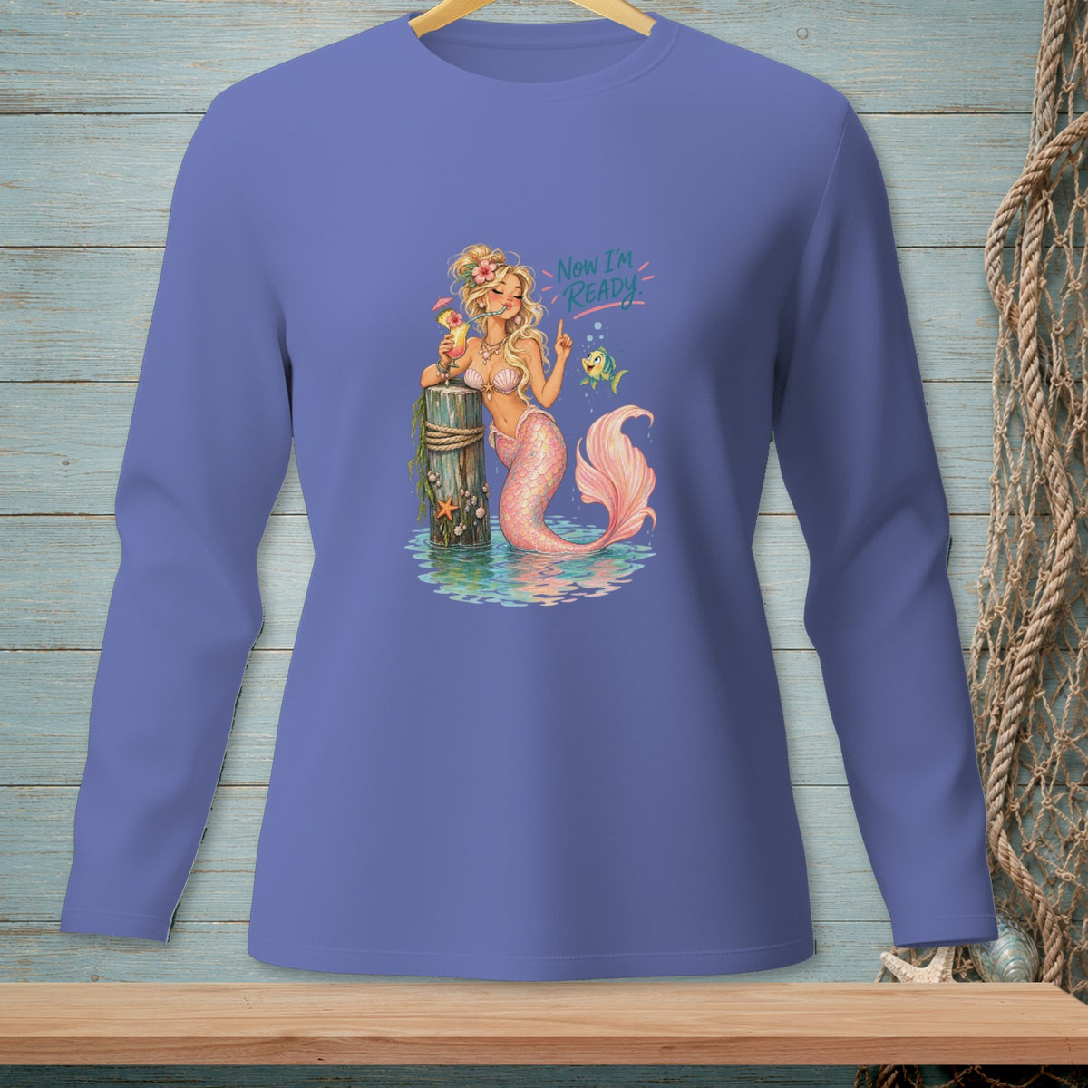 Blonde mermaid with pink tail holds a drink near a post with text "Now I'm READY".