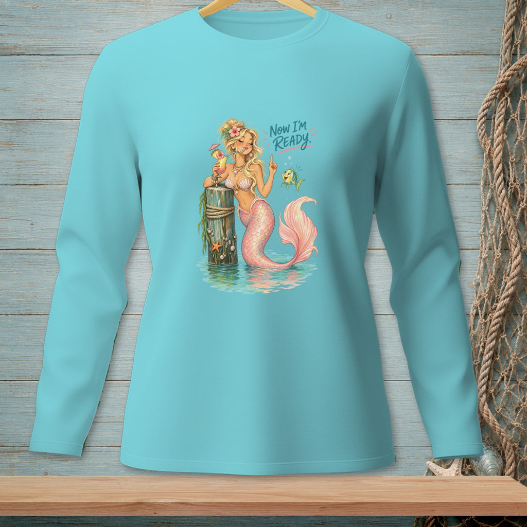 Mermaid with a drink and fish, text "Now I'm READY." on teal shirt.