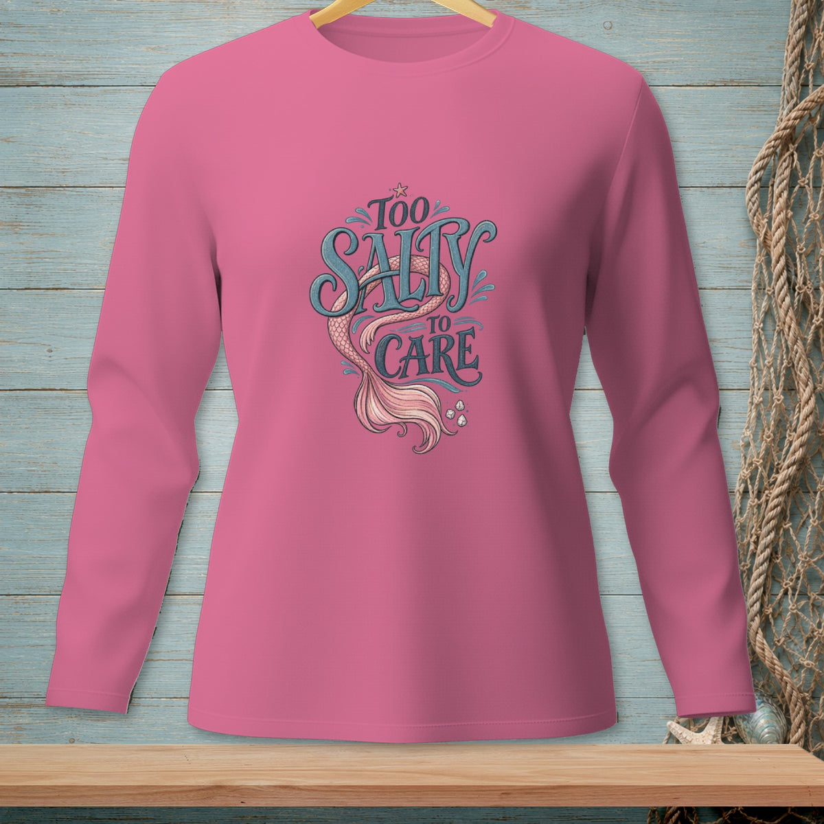 Pink long sleeve shirt with "Too Salty to Care" mermaid graphic.