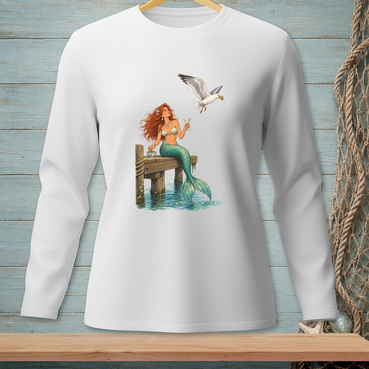 Mermaid with cocktail on dock, seagull flying overhead with food.