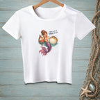 White t-shirt with a mermaid and pufferfish graphic and text.