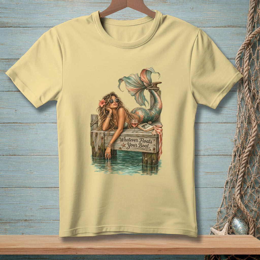 Mermaid with sunglasses and tail resting on dock, text reads "Whatever Floats Your Boat."