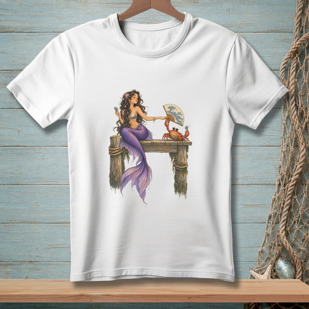 Mermaid on pier with a crab holding a fan, front view of white t-shirt.