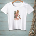 White t-shirt featuring a blonde mermaid interacting with a crab.