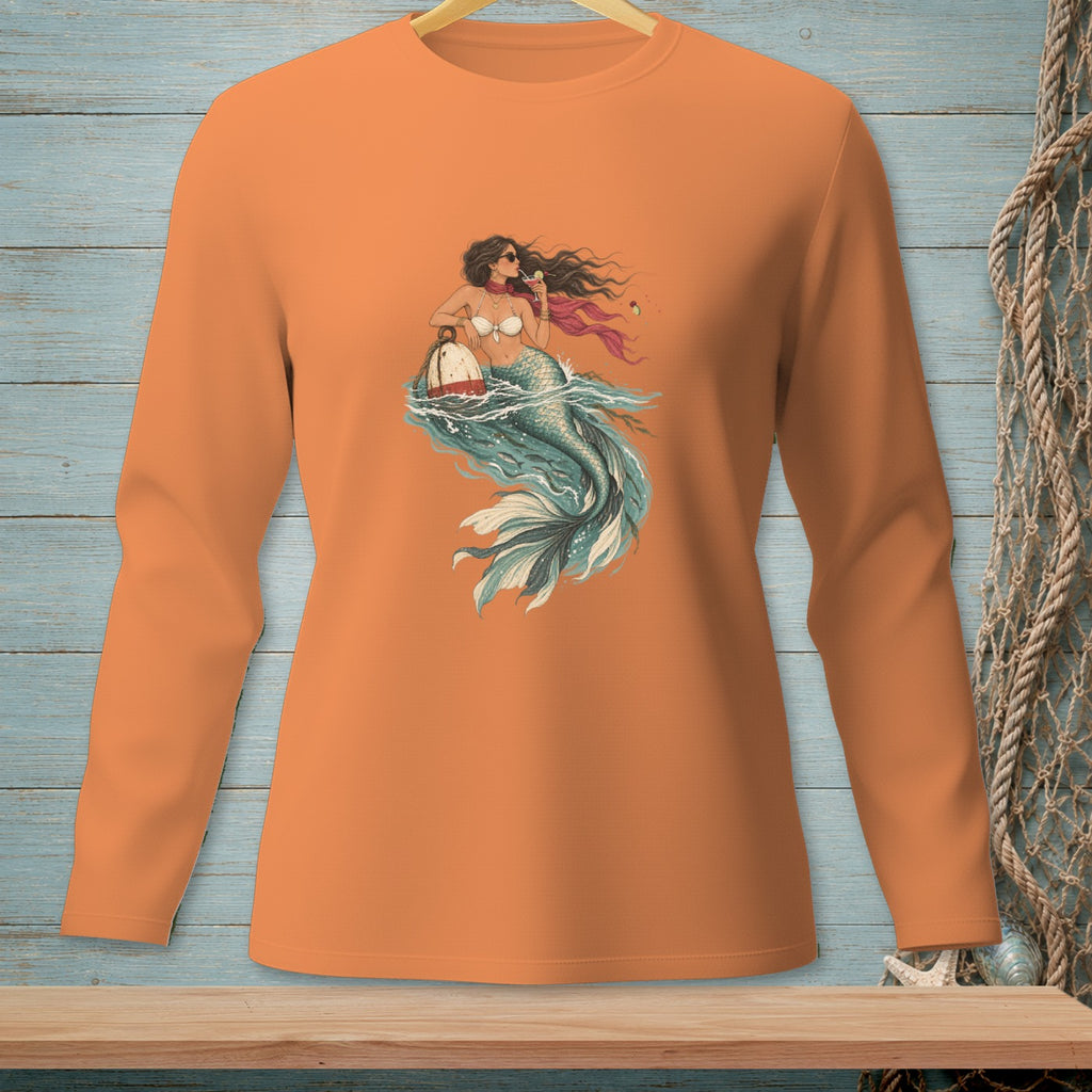 Long sleeve orange shirt with mermaid graphic holding a drink by a buoy.