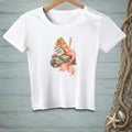White t-shirt with a mermaid holding a cocktail, sitting on a rock with text.