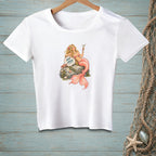 White t-shirt with a mermaid holding a cocktail, sitting on a rock with text.