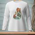White long-sleeve shirt with a watercolor print of a mermaid and lobster by a dock.