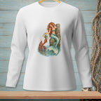 White long-sleeve shirt with a watercolor print of a mermaid and lobster by a dock.