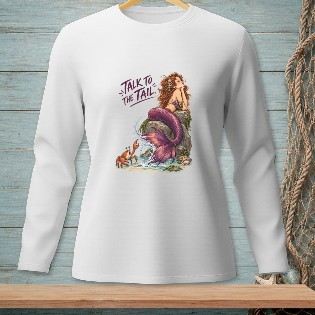 White long-sleeve shirt with a mermaid, crab, and text "Talk to the Tail."