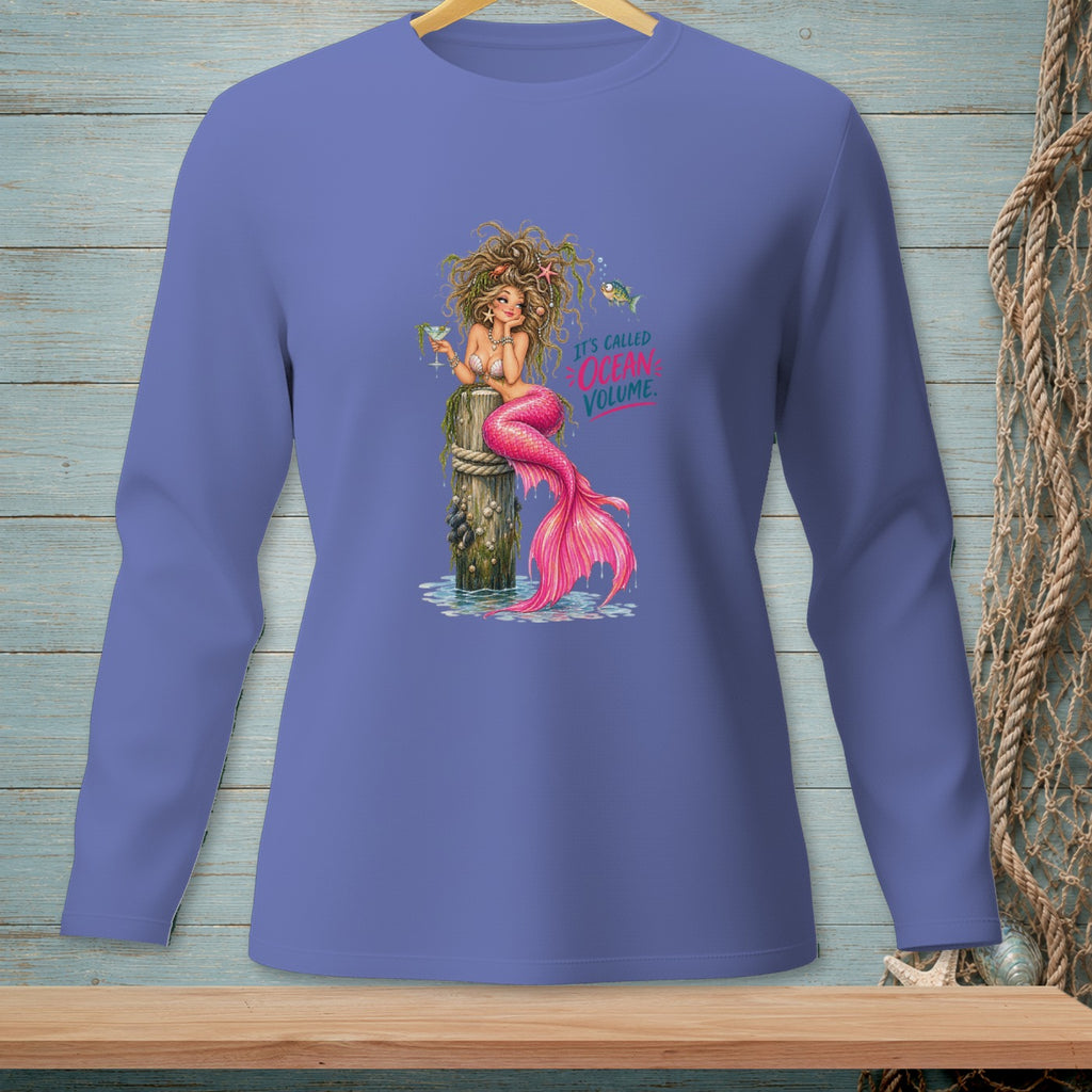 Illustration of a mermaid with pink tail sitting on a post with text "It's Called Ocean Volume".