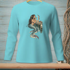 Teal long-sleeve shirt with a mermaid applying makeup to a fish.